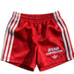 Red Athletic Shorts with White Stripes and Logo