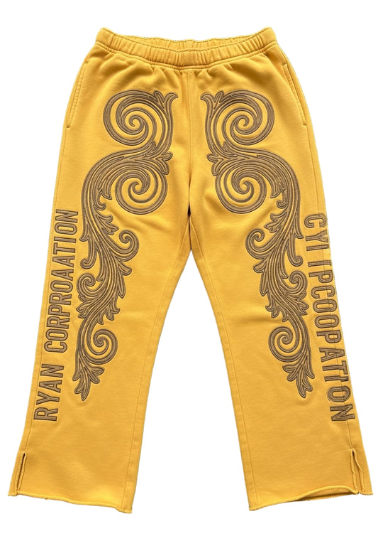 Yellow Sweatpants with Brown Embroidered Scrollwork and Vertical Branding – Ryan Corporation